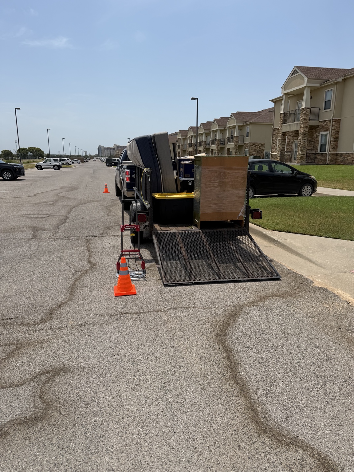 Loaded utility trailer at an apartment move